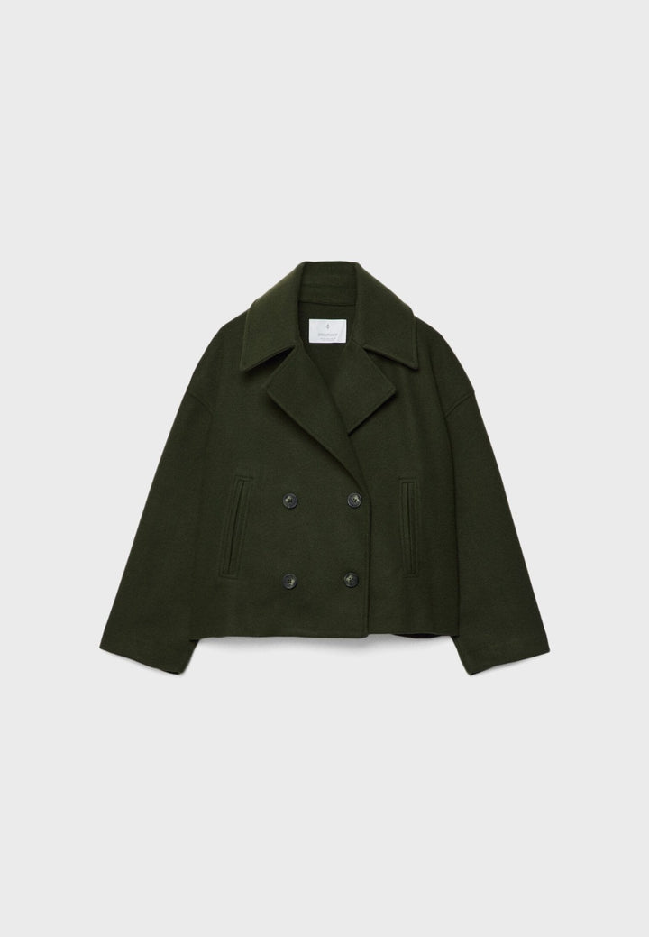 Women's double-breasted cropped jacket, front view featuring sharp lapels, structured design, and chic oversized buttons.
