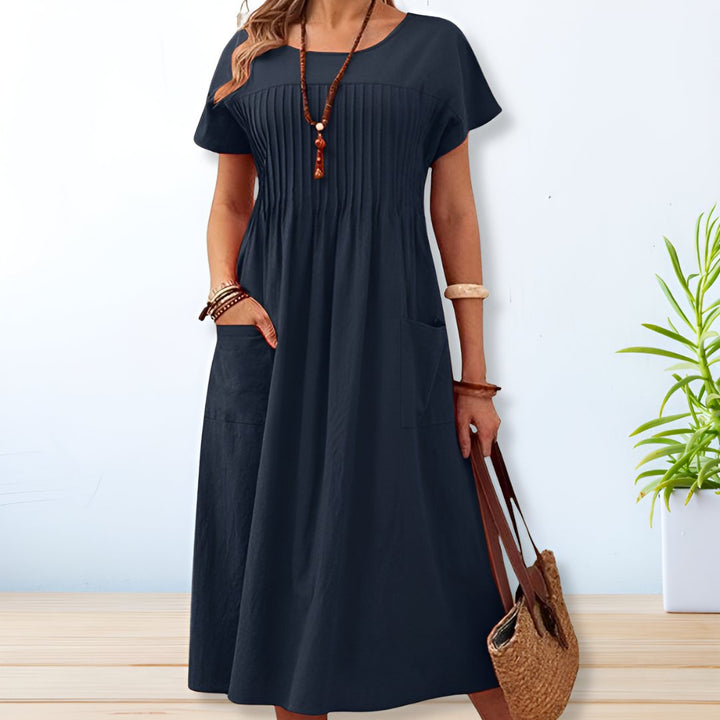 "Women's linen cotton summer dress, relaxed fit with pockets, short sleeves, mid-length, beige color, breathable fabric."