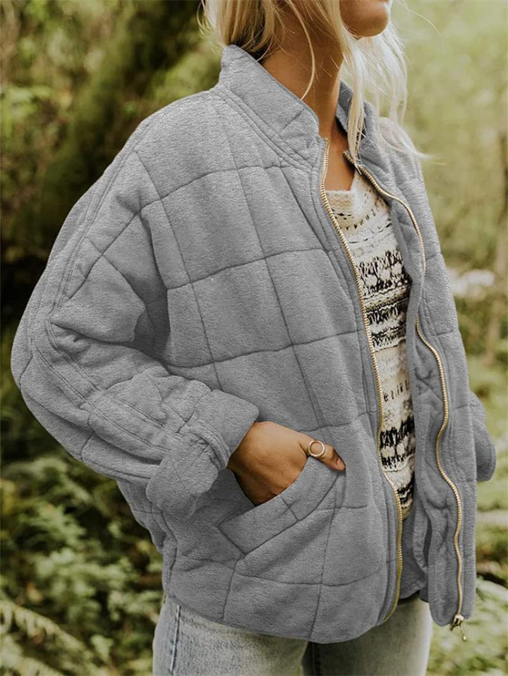 "Women's quilted jacket front view; classic design, versatile; visual texture with balanced warmth, perfect for layering."