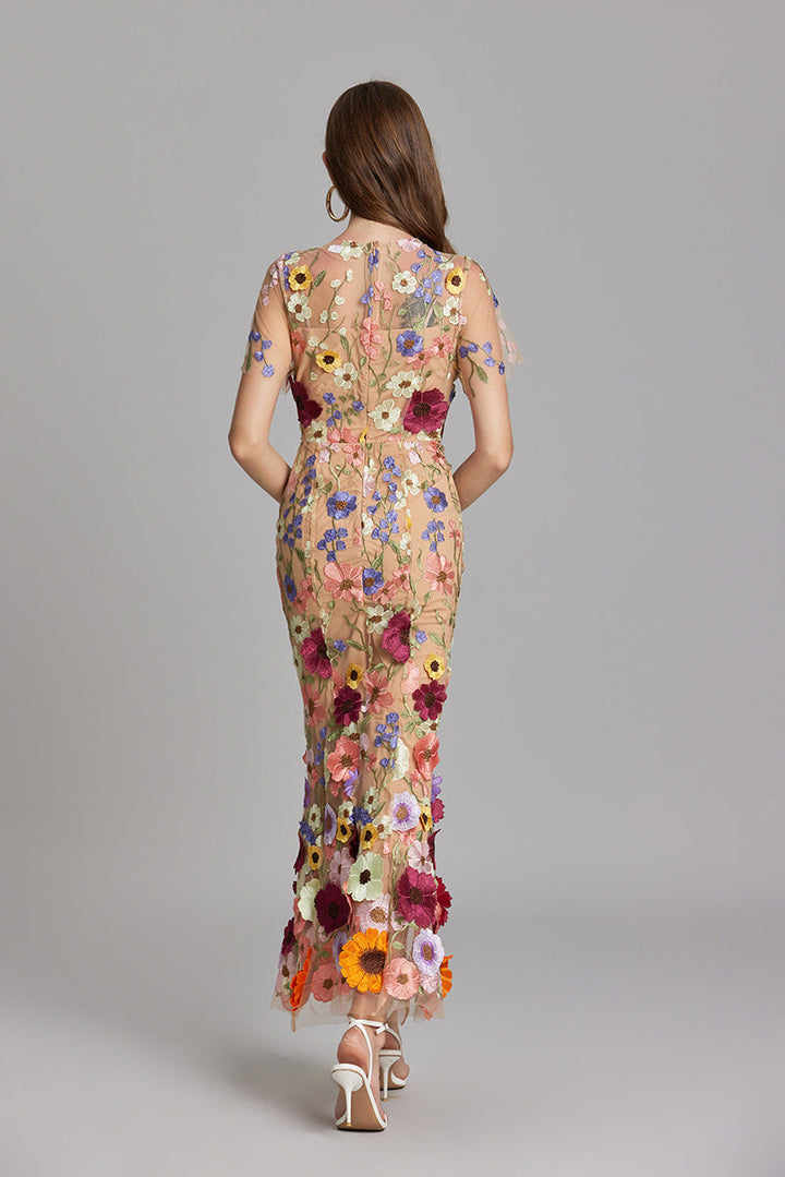 "Women's sheer embroidered maxi dress, elegant and flowing, in various colors; lightweight fabric for special occasions."