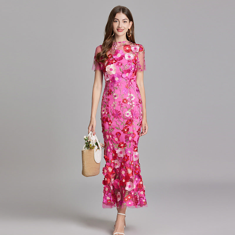 "Women's sheer embroidered maxi dress, elegant and flowing, in various colors; lightweight fabric for special occasions."