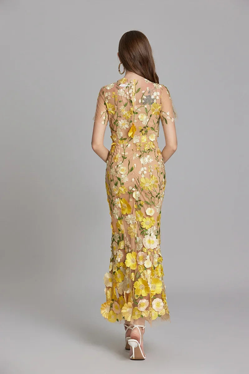 "Women's sheer embroidered maxi dress, elegant and flowing, in various colors; lightweight fabric for special occasions."