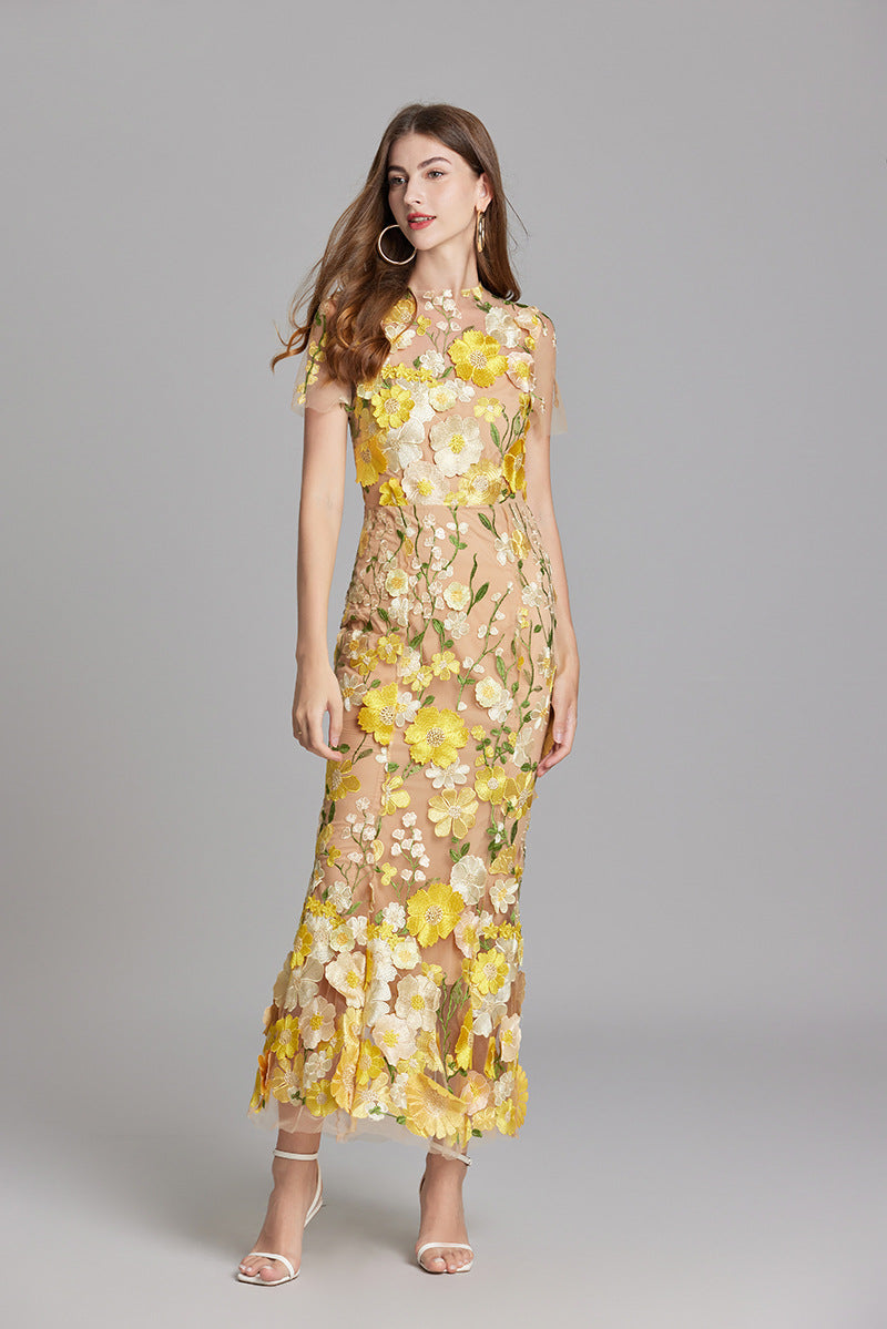 "Women's sheer embroidered maxi dress, elegant and flowing, in various colors; lightweight fabric for special occasions."
