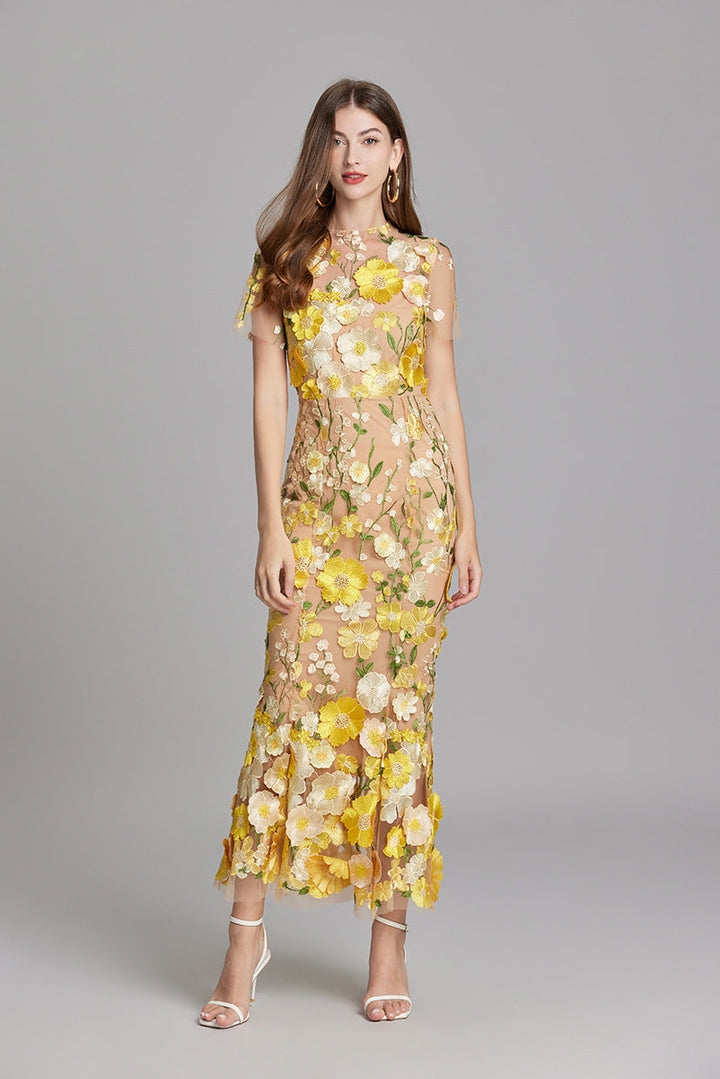 "Women's sheer embroidered maxi dress, elegant and flowing, in various colors; lightweight fabric for special occasions."