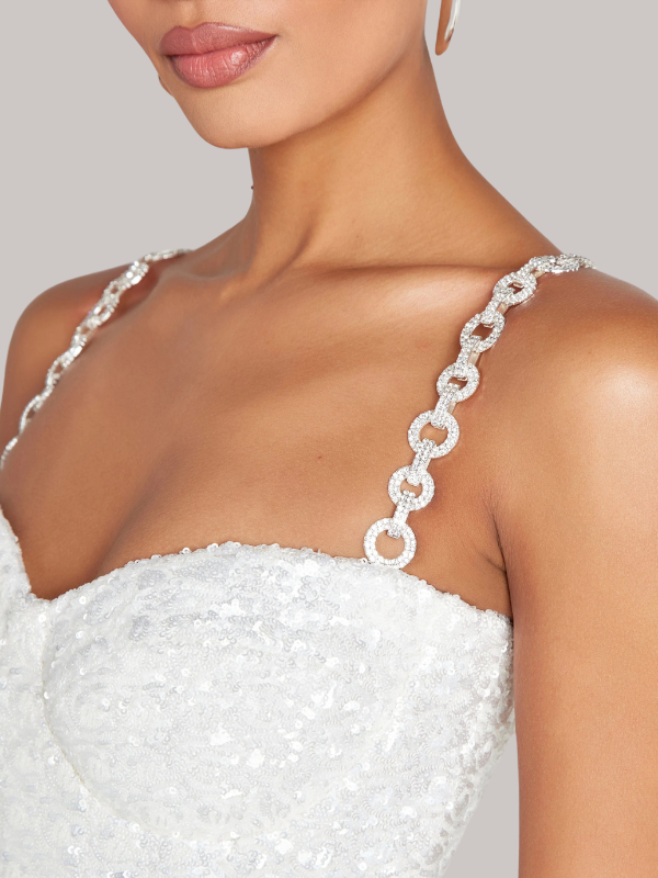 "Women's strapless glitter jumpsuit with waist belt, sparkling fabric, figure-hugging fit, ideal for evening events and parti