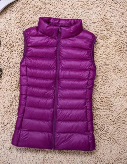 Women's ultra light down vest, stylish slim fit design, nylon material, stand collar, ideal for layering in autumn.