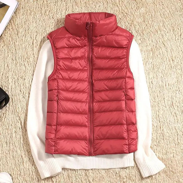 Women's ultra light down vest, stylish slim fit design, nylon material, stand collar, ideal for layering in autumn.