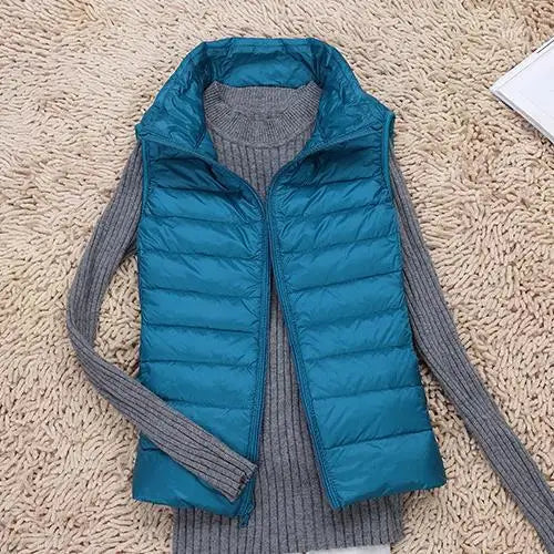 Women's ultra light down vest, stylish slim fit design, nylon material, stand collar, ideal for layering in autumn.