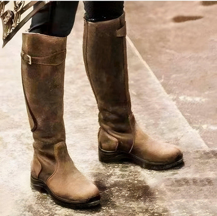 Women's waterproof leather boots with slip-resistant sole, durable build, elegant design, for all-weather comfort and style.