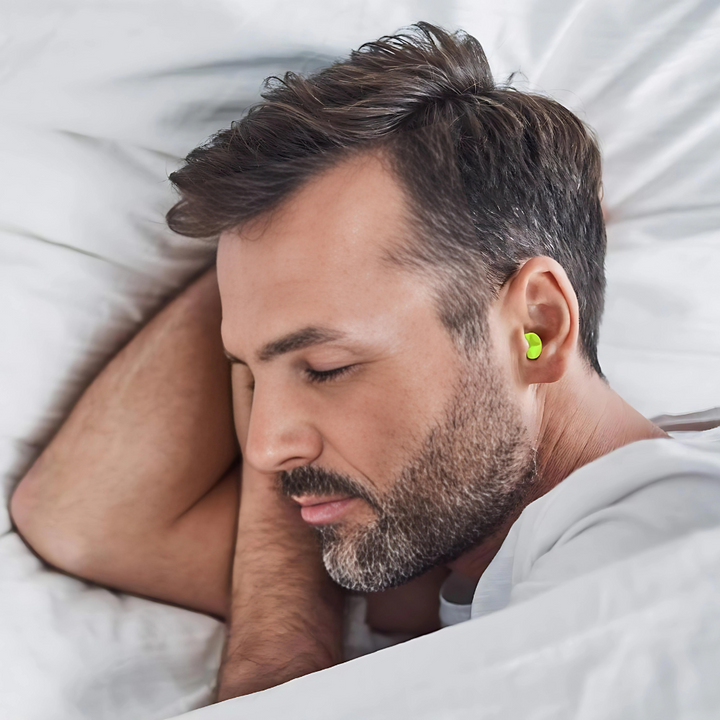 "Yellow noise-cancelling SilentComfort earplugs for sound isolation, sleep, travel, soft hypoallergenic comfort."