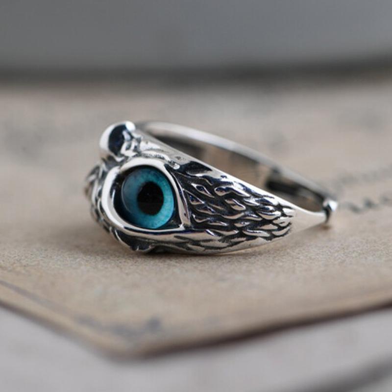Front view of a women's adjustable owl eye ring, unique copper design
