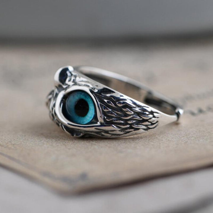 Front view of a women's adjustable owl eye ring, unique copper design