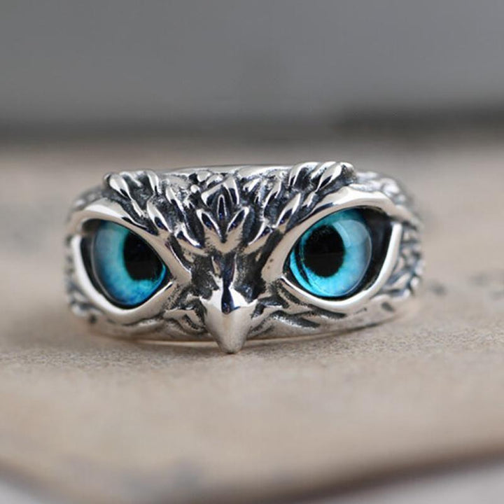 Hand modeling a women's copper owl eye ring, adjustable vintage jewelry