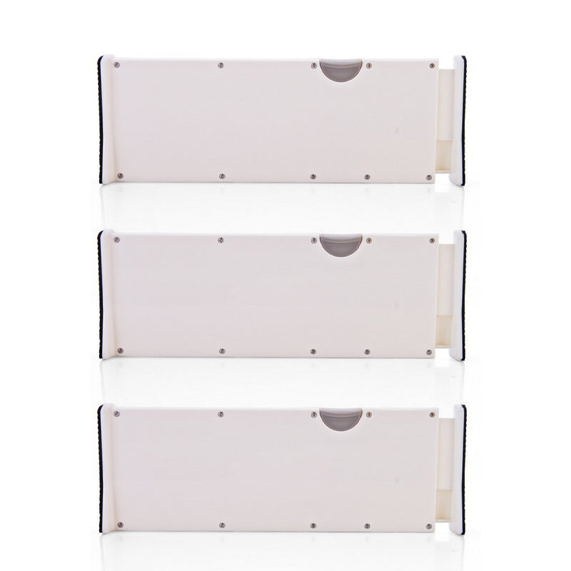 Drawer organizer dividers in a child's dresser drawer, separating small clothing items, adjustable