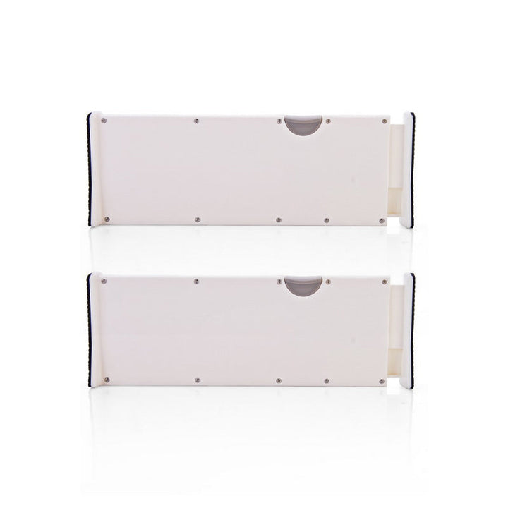 A set of adjustable white drawer dividers, displayed out of a drawer emphasizing their expandability