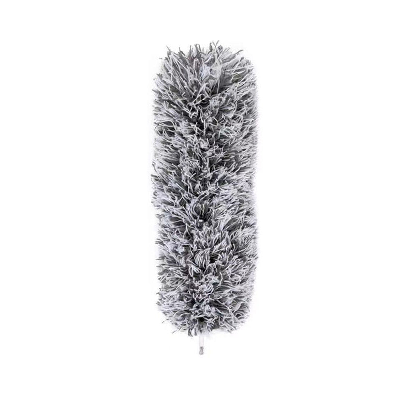 Corner cleaning with an extendable pole duster; the flexible head reaches awkward angles.