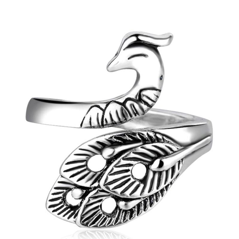 Close-up of an adjustable yarn guide ring, worn on finger, for knitting and crochet projects.