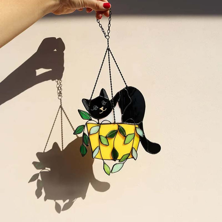 Vibrant stained glass cat in flowerpot window ornament, whimsical animal decor