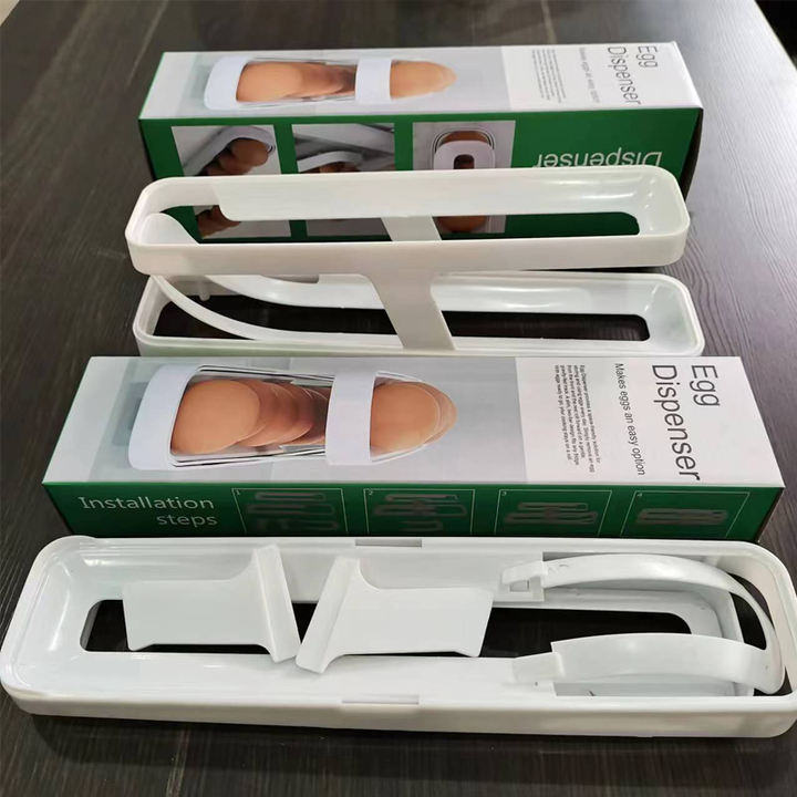 Product packaging for the Automatic Rolling Egg Dispenser, emphasizing 'space saving' and 'home organization'.