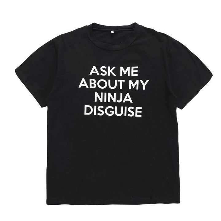 Novelty unisex black t-shirt featuring a playful flip-up ninja graphic, perfect for humor.