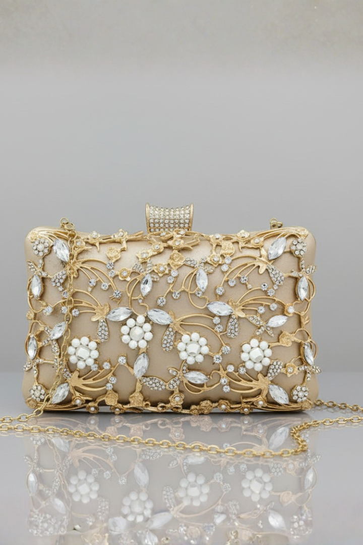 Formal black women's embroidered evening clutch bag with beautiful gold thread work and sparkling decorative stones.