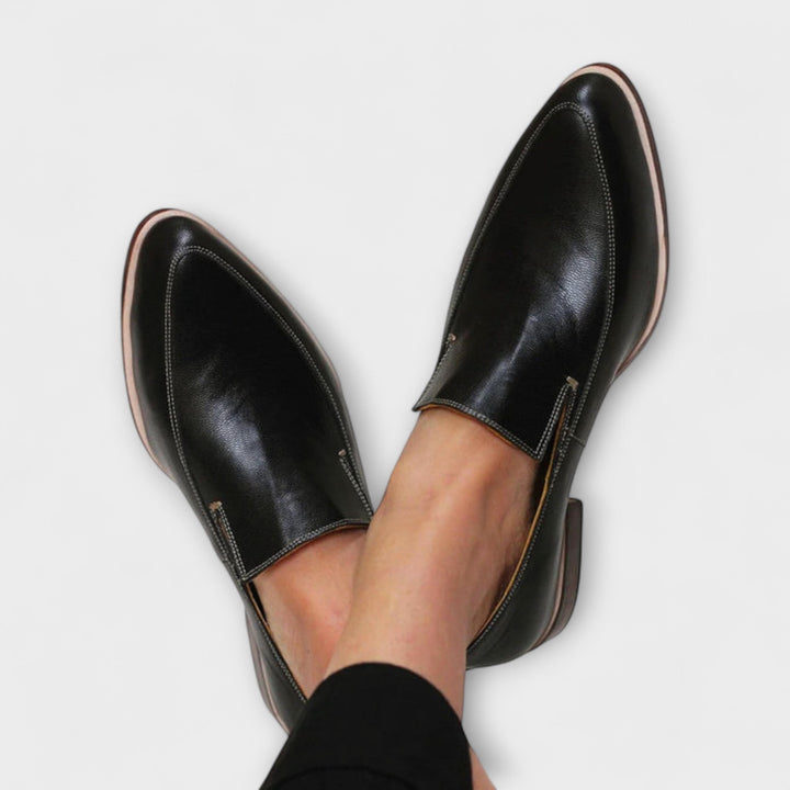 Black women's orthopedic loafers for all-day comfort. Supportive slip-on walking shoes with classic style.