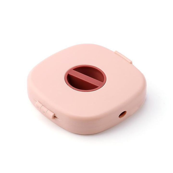 Packaging for the universal cable winder & phone stand, highlighting its use as a desk/cord organizer.