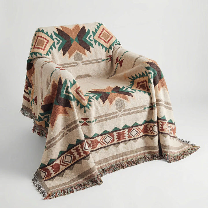 Decorative boho geometric woven blanket with fringe. Stylish southwestern tapestry or accent rug for modern homes.