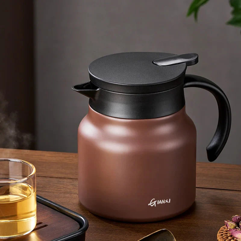 "Brown insulated teapot with ceramic liner and infuser, 800ml capacity, ideal for hot or cold beverages, kitchen essential."