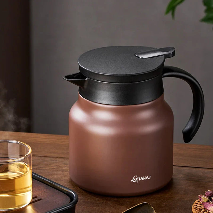 "Brown insulated teapot with ceramic liner and infuser, 800ml capacity, ideal for hot or cold beverages, kitchen essential."