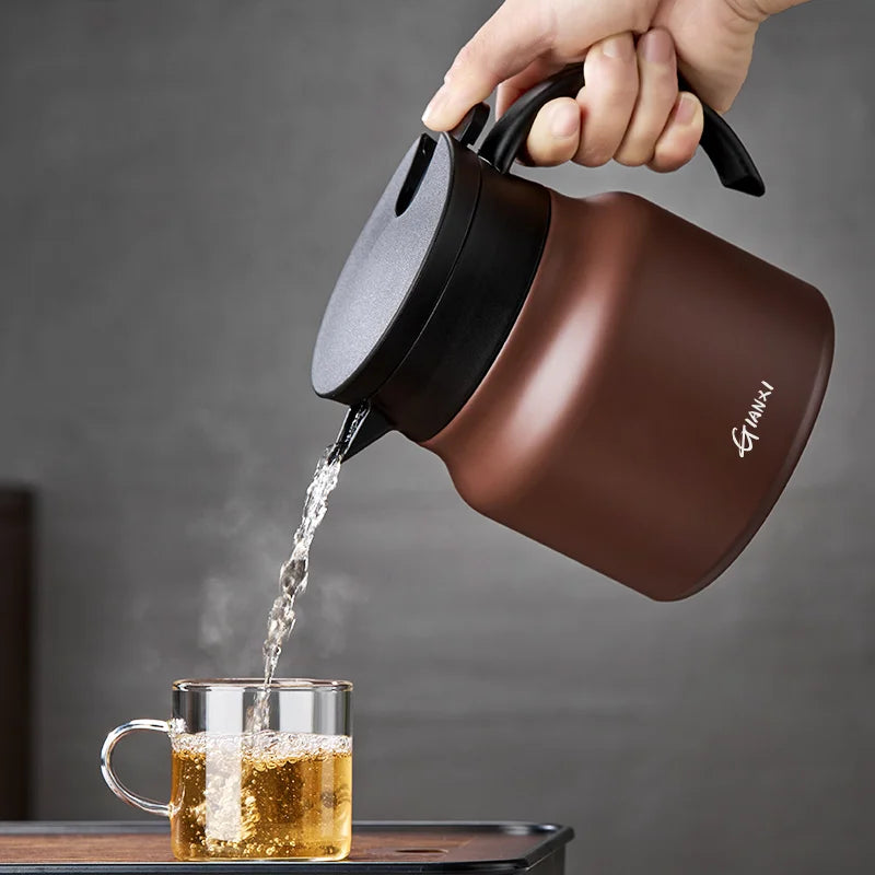 "Brown insulated teapot with ceramic liner and infuser, 800ml capacity, ideal for hot or cold beverages, kitchen essential."