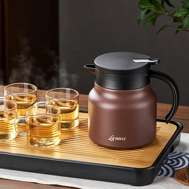 "Brown insulated teapot with ceramic liner and infuser, 800ml capacity, ideal for hot or cold beverages, kitchen essential."
