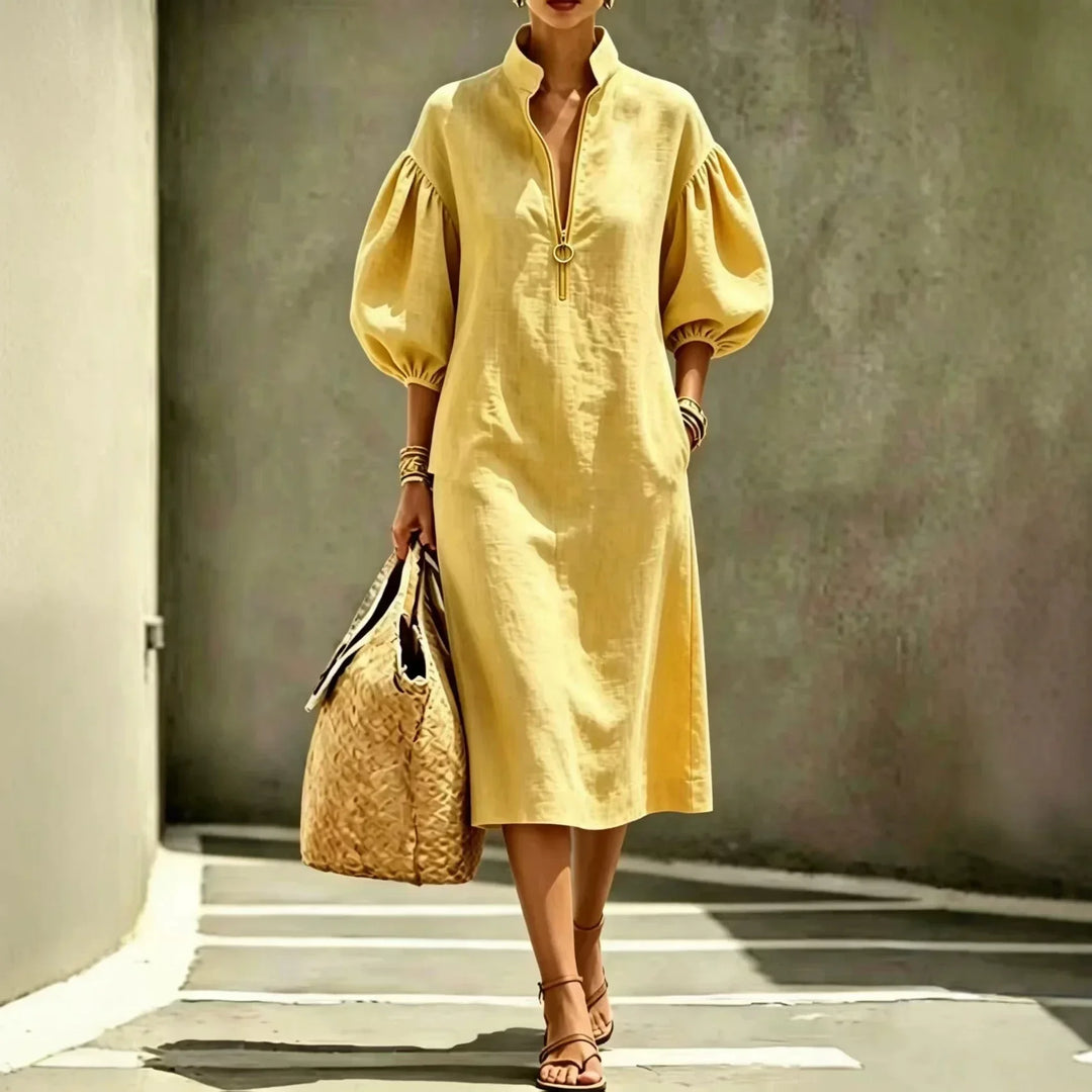 Women's elegant midi dress for work or weekend. Features chic bubble sleeves, stand collar, and relaxed, comfortable fit.