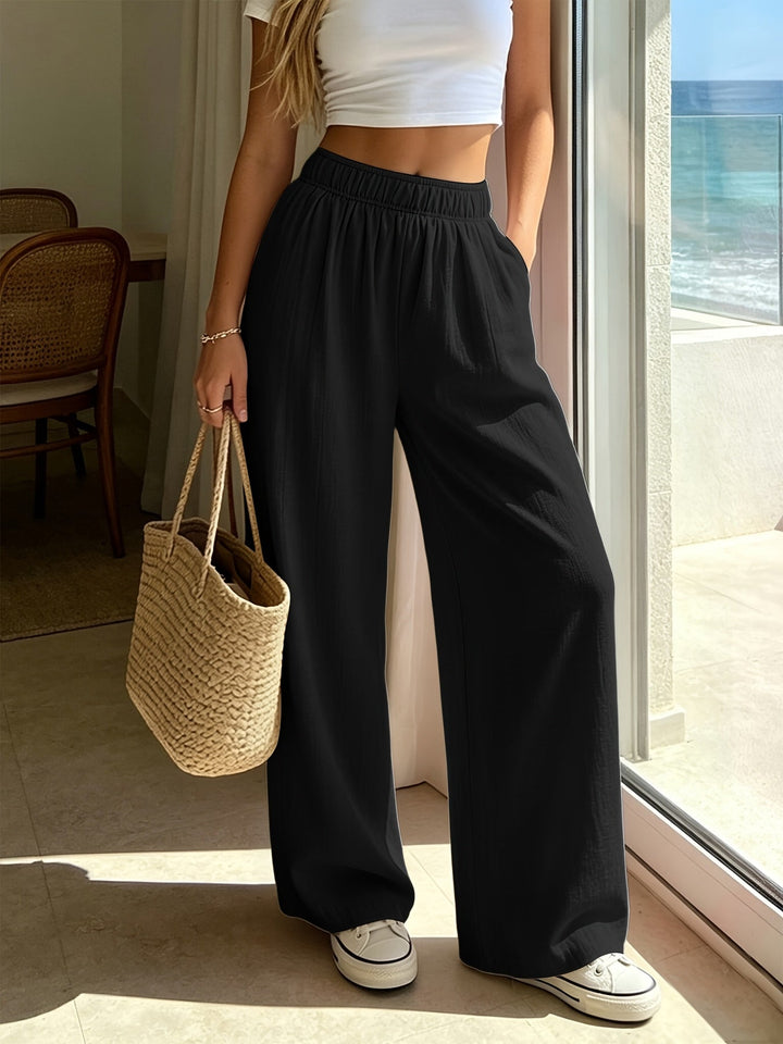 Comfortable high waist wide leg pants for women. Relaxed fit, flowing fabric, ideal for spring & summer casual wear.
