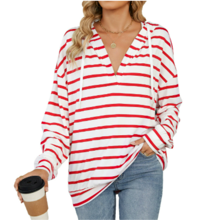 Fashionable women's hooded pullover with a flattering fit. Chic long sleeve hoodie for versatile everyday wear.