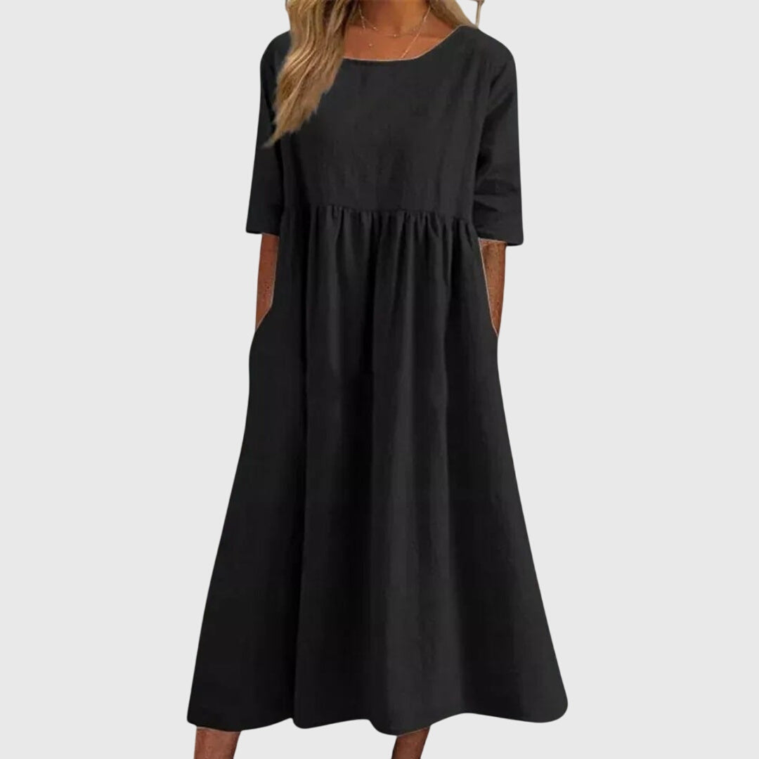 Modern women's short-sleeved dress offering chic style and a flattering fit. Great for summer events.