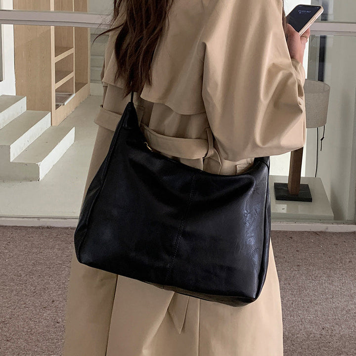 Close-up of PU Leather Texture on Women's Solid Crossbody Shoulder Bag
