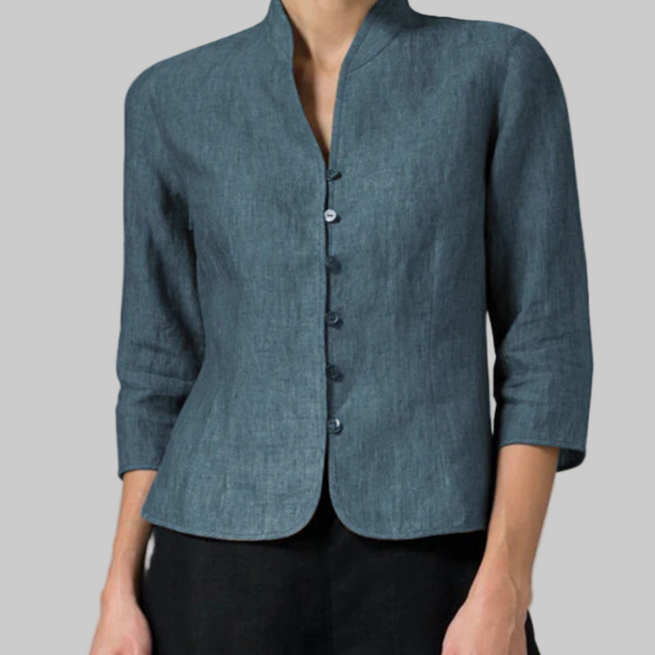 Fashionable women's stand-collar blouse featuring three-quarter sleeves. A versatile button-front top for women.