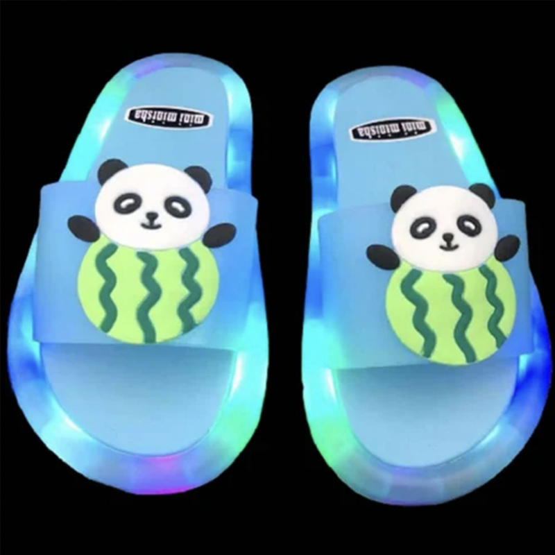 Detail of the LED lights on a child's summer slipper, glowing brightly.