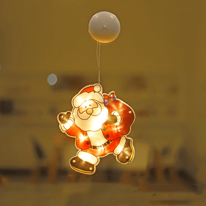 Christmas Window LED light in the shape of a present, easily attachable with suction cup, festive seasonal decor