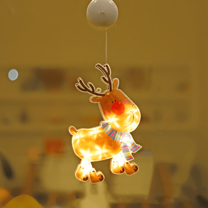 Hand holding a Christmas Window Suction Cup LED Light before attachment, showing product readiness