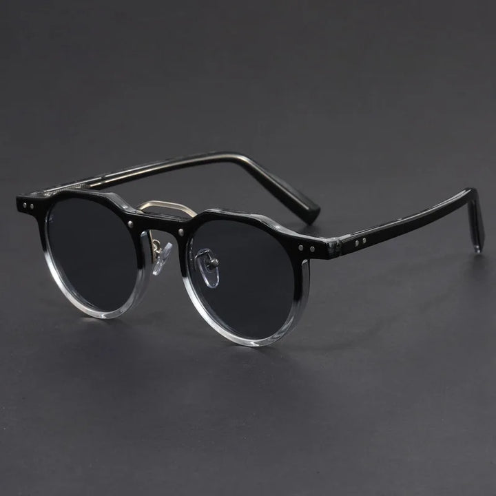 Close-up of unisex round sunglasses, highlighting the quality frame and UV400 protective lenses.