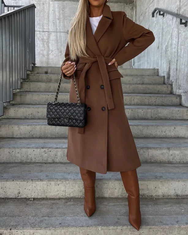 Elegant women's long sleeve trench coat in neutral tone, ideal for stylish fall and winter outerwear.
