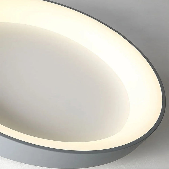 Contemporary circular metal LED ceiling light, sleek design with acrylic finish, emits soft warm or cool lighting for home de