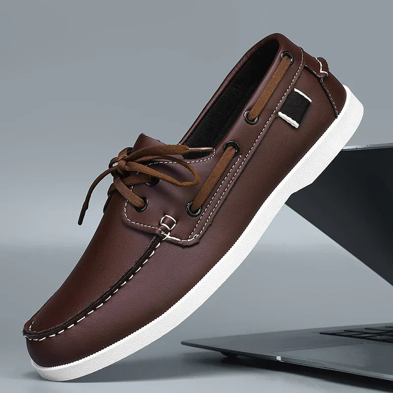 Man wearing Corvan men's deck loafers with casual trousers, showcasing the comfortable fit and style.