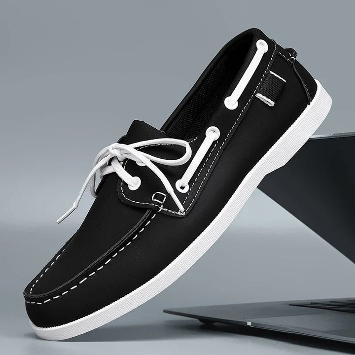 Corvan men's vegan leather deck loafers arranged artfully, highlighting their classic and timeless design.
