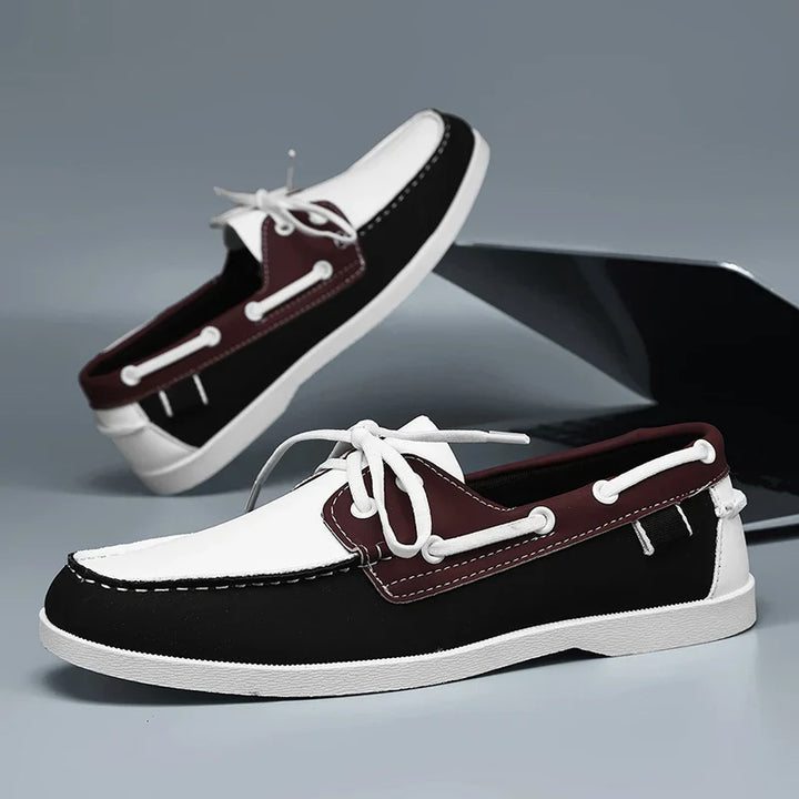 Corvan men's deck shoes on a wooden deck, accentuating their nautical style and summer footwear appeal.