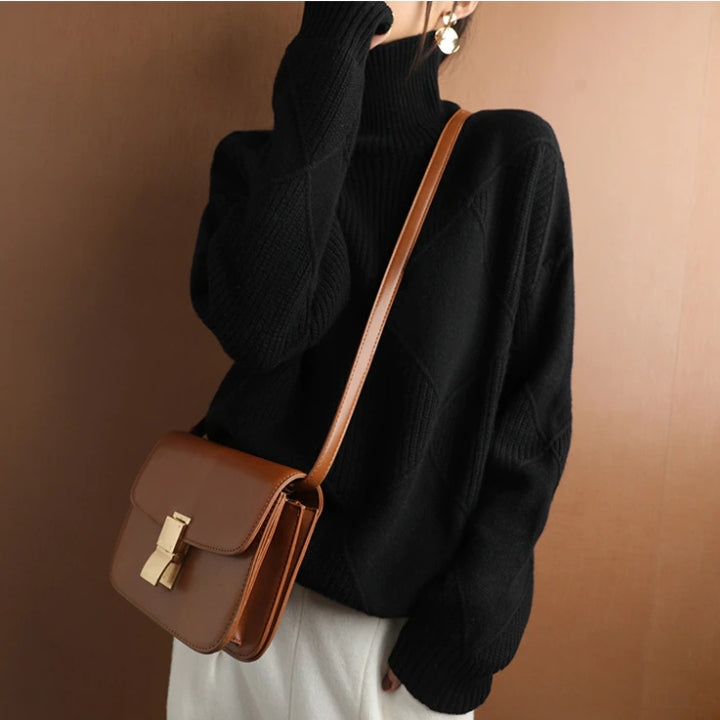 Detailed view of the cuffs on a women's cozy oversized ribbed knit sweater