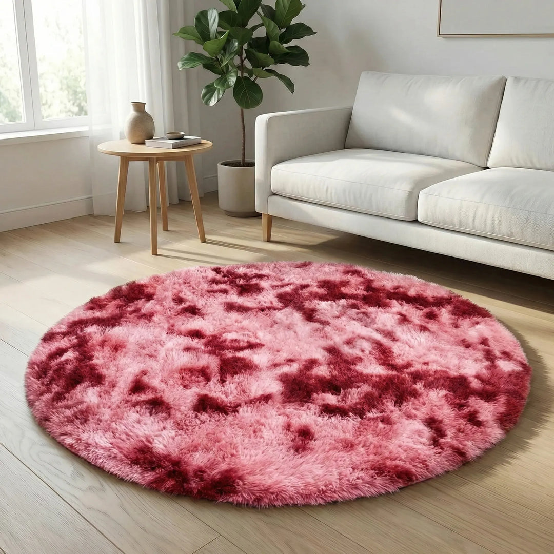 Eye-catching round tie-dye rug with a soft plush finish, creating a vibrant focal point in modern homes.