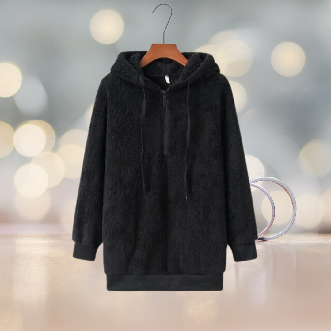 Woman wearing a cozy hooded autumn jacket, ideal for casual comfort & fall outfits.